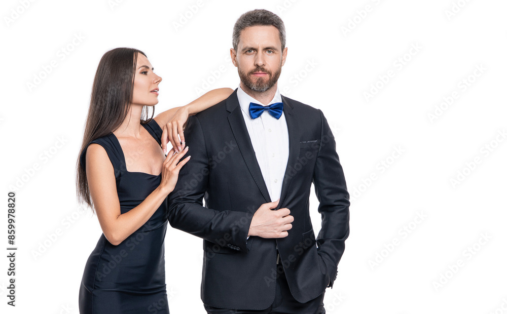 Woman in dress and man in suit with bowtie. Elegant couple isolated on white. Romantic couple spending time together. Two of man and woman on valentines day. Lovely couple dating. Elegant twosome Woman in dress and man in suit with bowtie. Elegant couple isolated on white. Romantic couple spending time together. Two of man and woman on valentines day. Lovely couple dating. Elegant twosome