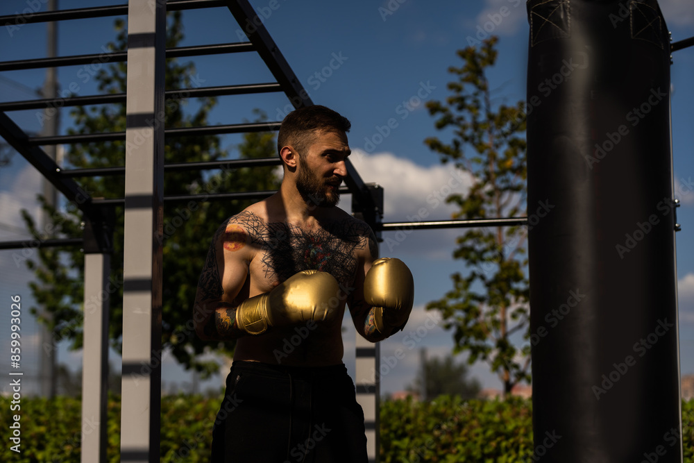 young naked boxer wearing protecting gloves. young naked boxer wearing protecting gloves.