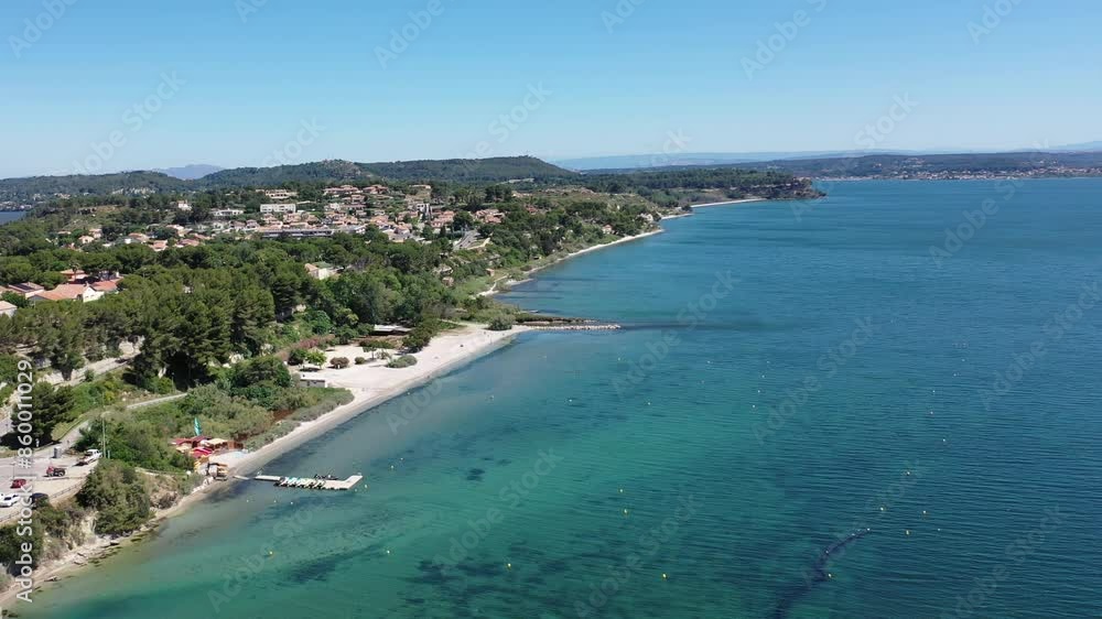 Aerial view drone video flying from the air over the picturesque sea coast of the south of France, Provence, Istres at bright sunny summer day Aerial view drone video flying from the air over the picturesque sea coast of the south of France, Provence, Istres at bright sunny summer day