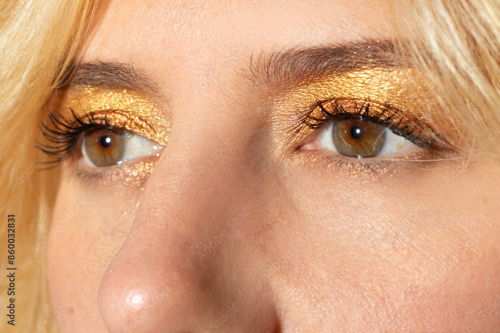 Fototapeta premium woman's look with honey-colored eyes and blonde hair