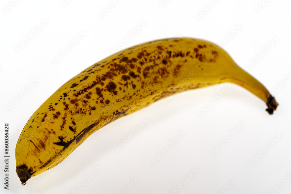 Top view of ripe yellow and brown colored banana against white background. Photo taken June 22nd, 2024, Zurich, Switzerland. Top view of ripe yellow and brown colored banana against white background. Photo taken June 22nd, 2024, Zurich, Switzerland.