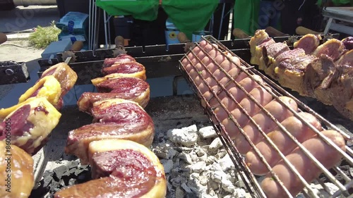 Various kind of tasty rolling grilled beef and pork on a street food stall