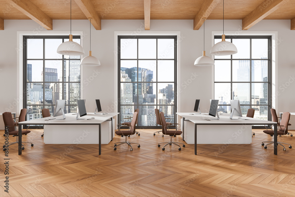 Fototapeta premium Modern office space with desks and computers, large windows. Wood floor, bright ambiance. Concept of modern workspace, urban office. 3D Rendering