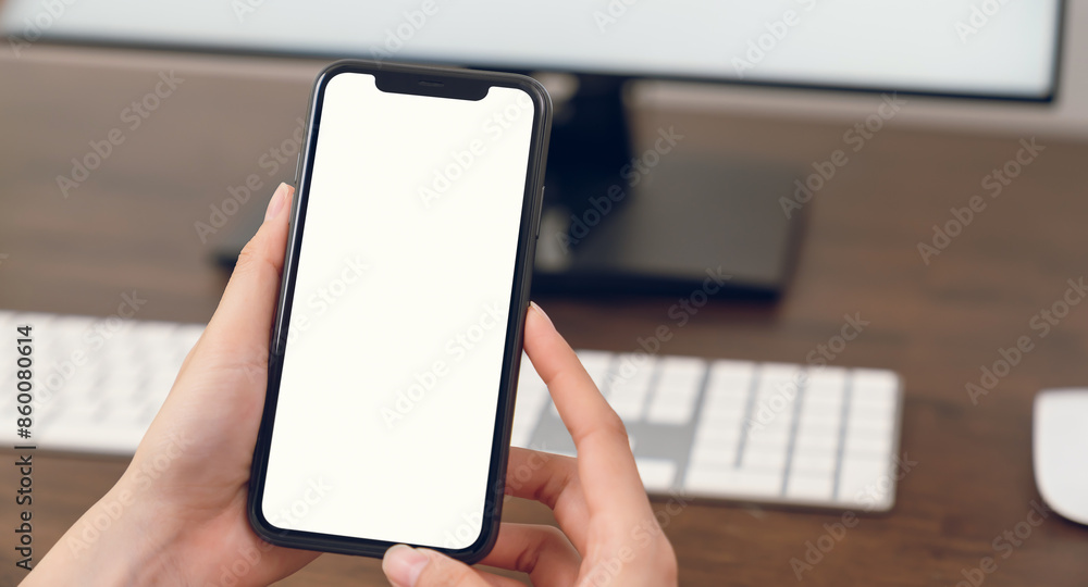Hand holding smartphone mockup of blank screen for graphic display montage. Hand holding smartphone mockup of blank screen for graphic display montage.