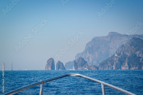 Obraz na płótnie Sailing to famous Faraglioni rocks in Capri island, Italy. w salonie