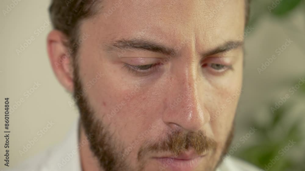 Intense slow motion of man lost in contemplation Intense slow motion of man lost in contemplation