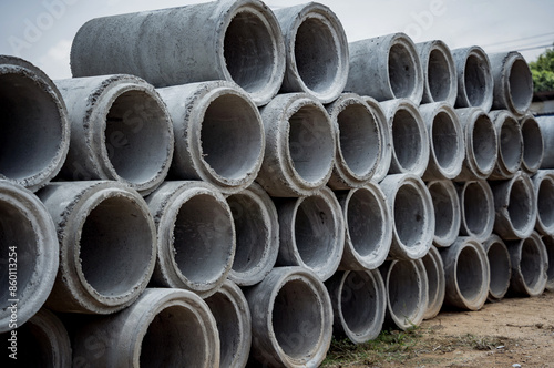 A stack of concrete ring pipes piled and creating a symmetrical arrangement © romaset