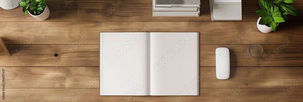 An open notebook with blank white pages on a wooden table, perfect for mockup design. An open notebook with blank white pages on a wooden table, perfect for mockup design.