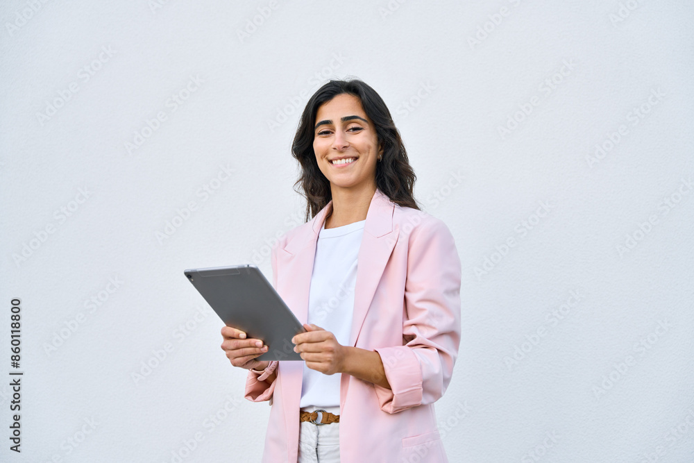 Young indian or arabic woman in business holding digital computer, looking at camera. Portrait of middle eastern Israel businesswoman using tablet pc online app for work isolated on white background. Young indian or arabic woman in business holding digital computer, looking at camera. Portrait of middle eastern Israel businesswoman using tablet pc online app for work isolated on white background.