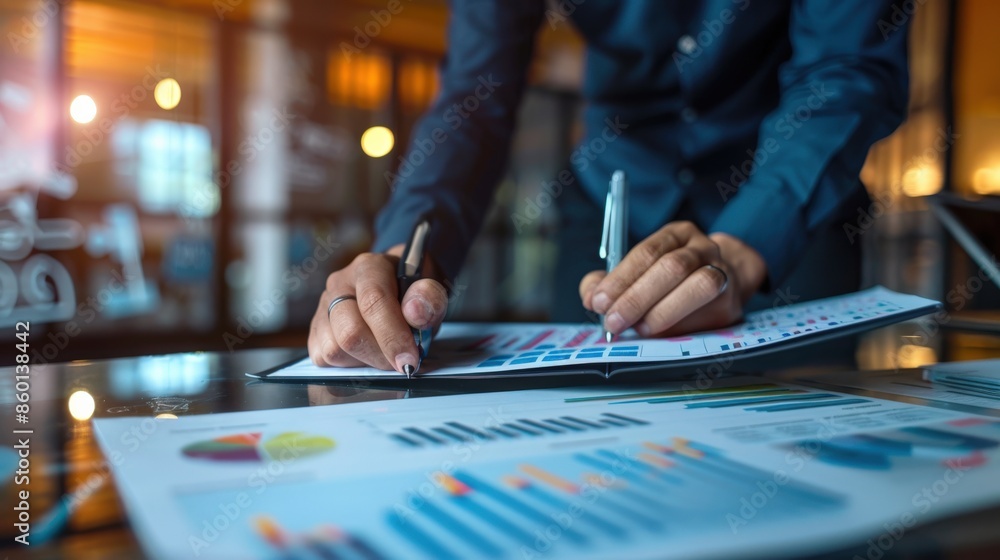 Businessman Analyzing Financial Charts and Data Businessman Analyzing Financial Charts and Data