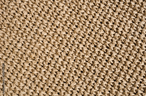 Beige raffia crochet texture. Crocheted bags, clutches, hats, wallets.