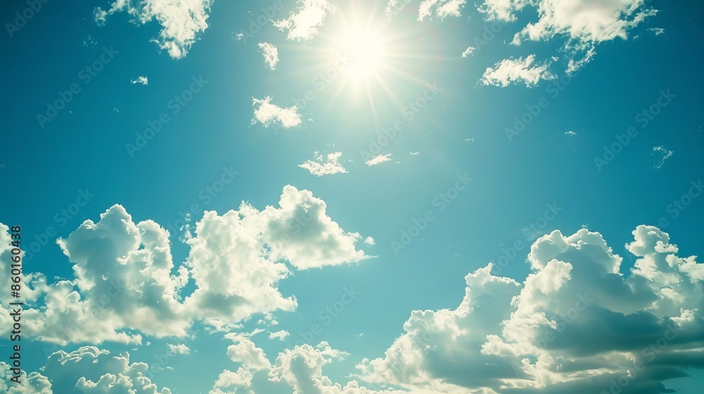 A bright blue sky with puffy white clouds. It's a perfect summer day. A bright blue sky with puffy white clouds. It's a perfect summer day.