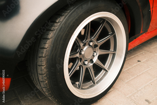 Sports car wheel close up, tuning and car upgrade concept