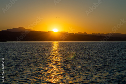 Sunrise over the beach and city in Malaga, Spain