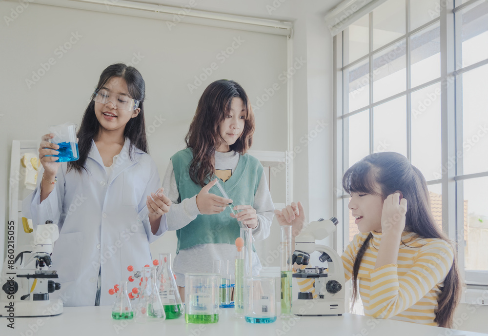 Portrait child kid girl asian young student tree people team group learning and smile have fun happy excited with science lab technology with in classroom has tubetest Microscope chemicals on table Portrait child kid girl asian young student tree people team group learning and smile have fun happy excited with science lab technology with in classroom has tubetest Microscope chemicals on table