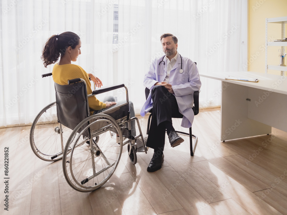 Portrait latin american woman sick sit wheelchair with man doctor caucasian sitting two people check and treat patients talk helping support explain medicine sick person inside hospital room Portrait latin american woman sick sit wheelchair with man doctor caucasian sitting two people check and treat patients talk helping support explain medicine sick person inside hospital room