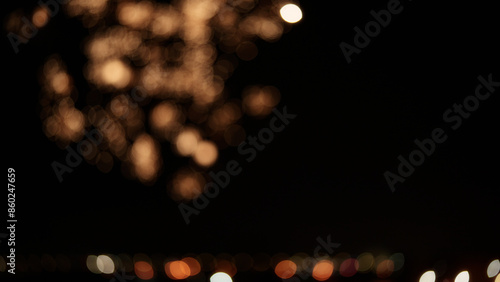 Fotografie Blurred background of fireworks over night city stop motion aesthetic