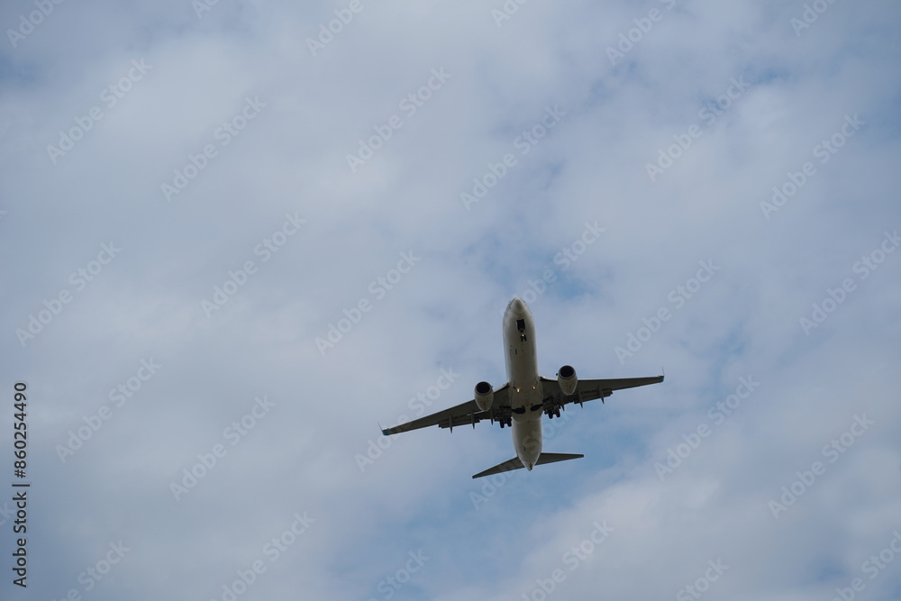 Airplane taking off in a cloudy sky Airplane taking off in a cloudy sky