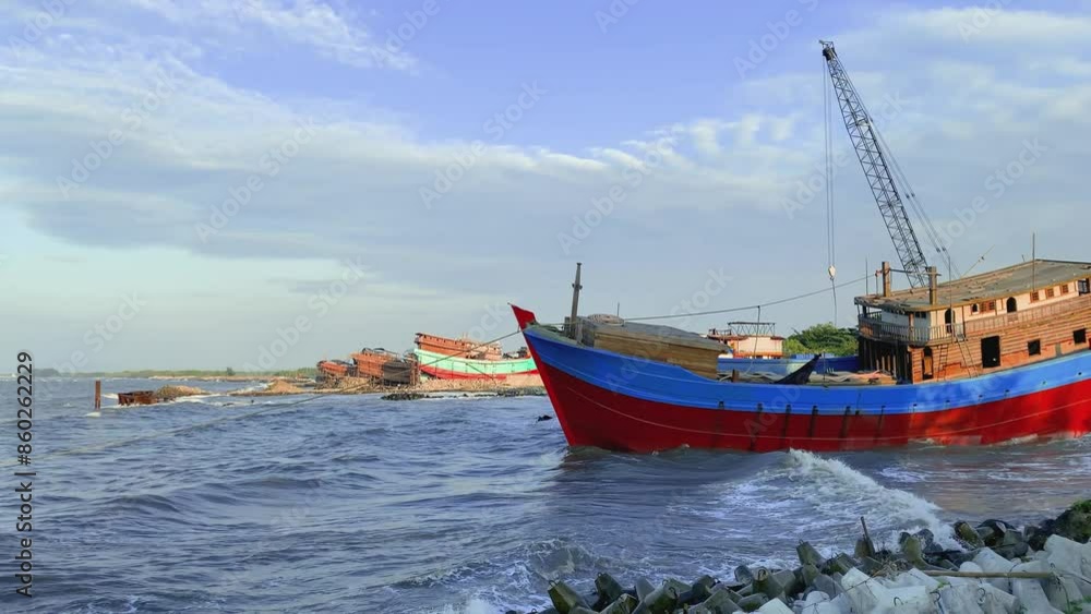 fishing boats in the harbor, wooden shipbuilding industry on the Slamaran coast of Pekalongan, Central Java fishing boats in the harbor, wooden shipbuilding industry on the Slamaran coast of Pekalongan, Central Java