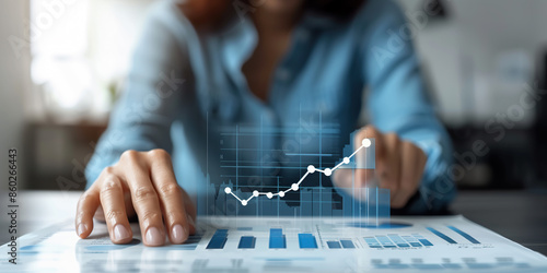 A businesswoman analyzes data and trends on a digital screen, utilizing AI technology to enhance insights and make informed decisions