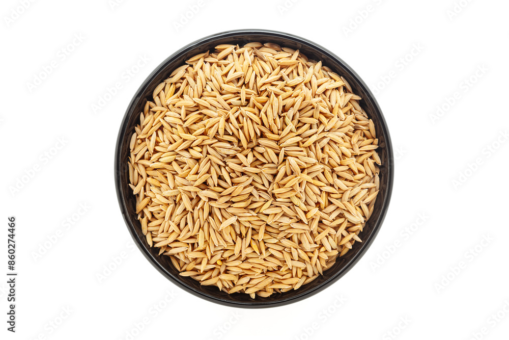 Organic Rice with Bran (Oryza sativa) or Dhaan, in a black ceramic bowl. Isolated on a white background. Top View Organic Rice with Bran (Oryza sativa) or Dhaan, in a black ceramic bowl. Isolated on a white background. Top View