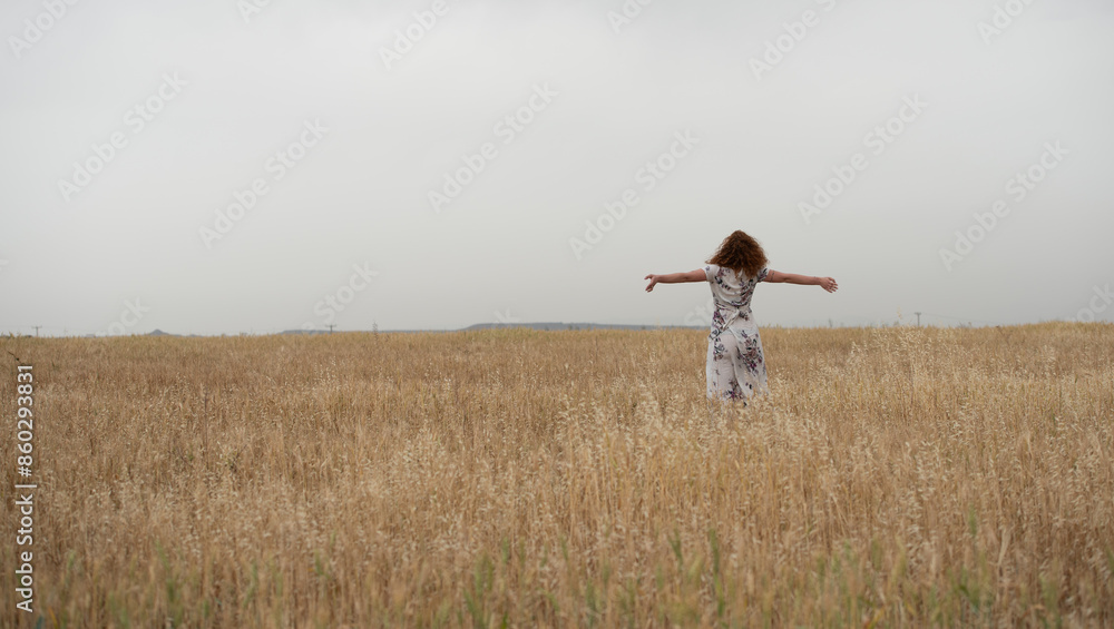 Joyful woman embracing nature in wheat field Joyful woman embracing nature in wheat field