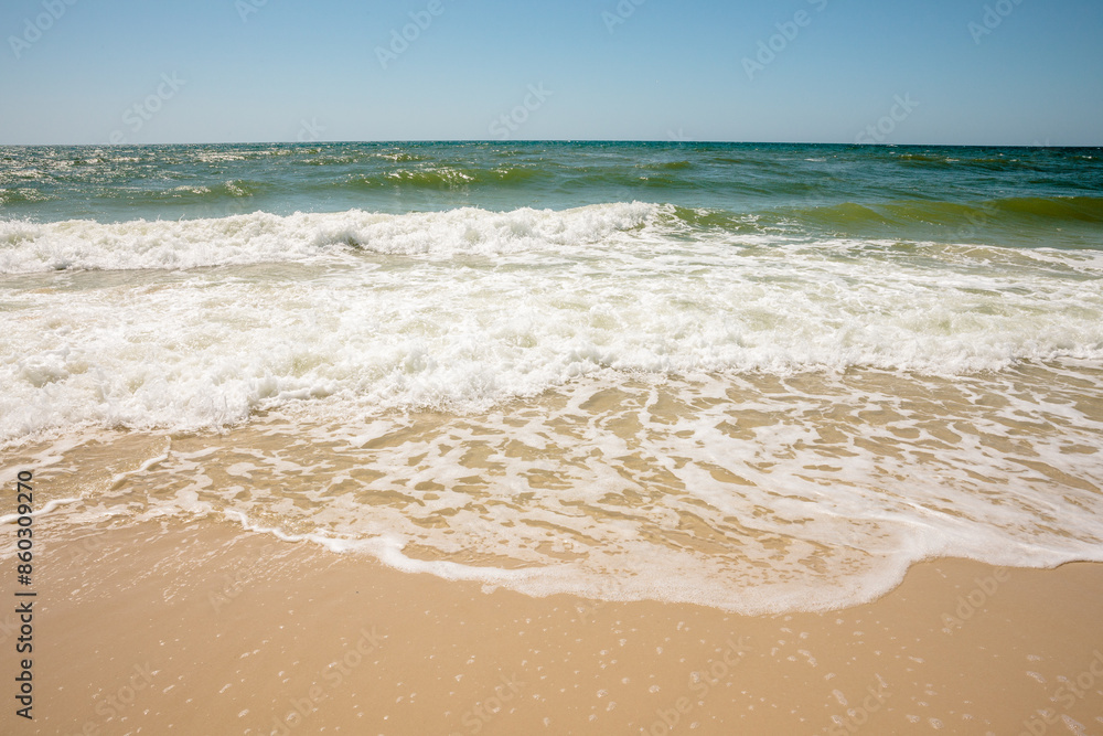 The Gulf of Mexico rinses the sand between waves in mid-April within Gulf State Park, Gulf Shores, Alabama The Gulf of Mexico rinses the sand between waves in mid-April within Gulf State Park, Gulf Shores, Alabama