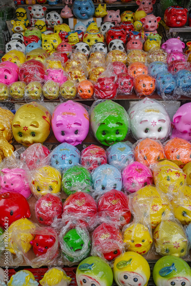 Hanoi, Vietnam - 9 Feb, 2024: A market stall selling colorful Piggy Banks ahead the Tet Lunar New Year holidays in Vietnam Hanoi, Vietnam - 9 Feb, 2024: A market stall selling colorful Piggy Banks ahead the Tet Lunar New Year holidays in Vietnam
