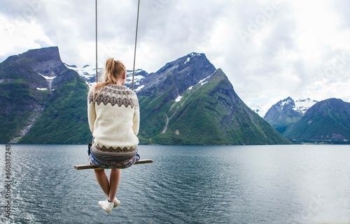 Swing in Trandal,  Møre og Romsdal, Norway. Fjords and mountains. Knittwear photo