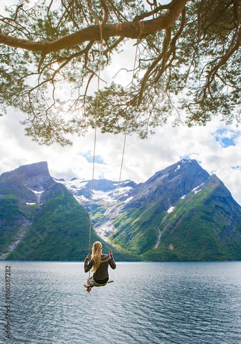 Swing in Trandal,  Møre og Romsdal, Norway. Fjords and mountains. Knittwear photo