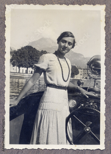 OLD PHOTO OF GIRL ON MOTORBOAT