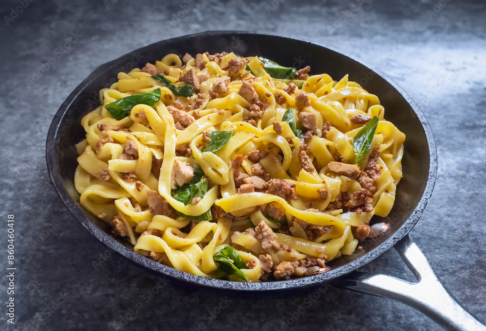 Homemade Udon with tofu in a frying pan Homemade Udon with tofu in a frying pan