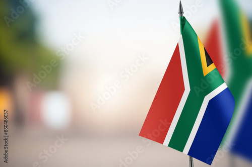 Small flags of South Africa on a blurred background