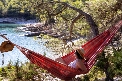 Obraz na płótnie Woman in a hammock in Stupica Bay on the island of Zirje in Croatia w salonie
