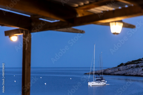 Obraz na płótnie Sailing yacht at the buoy on Mediterranean coast of the island Zirje in Croatia w salonie