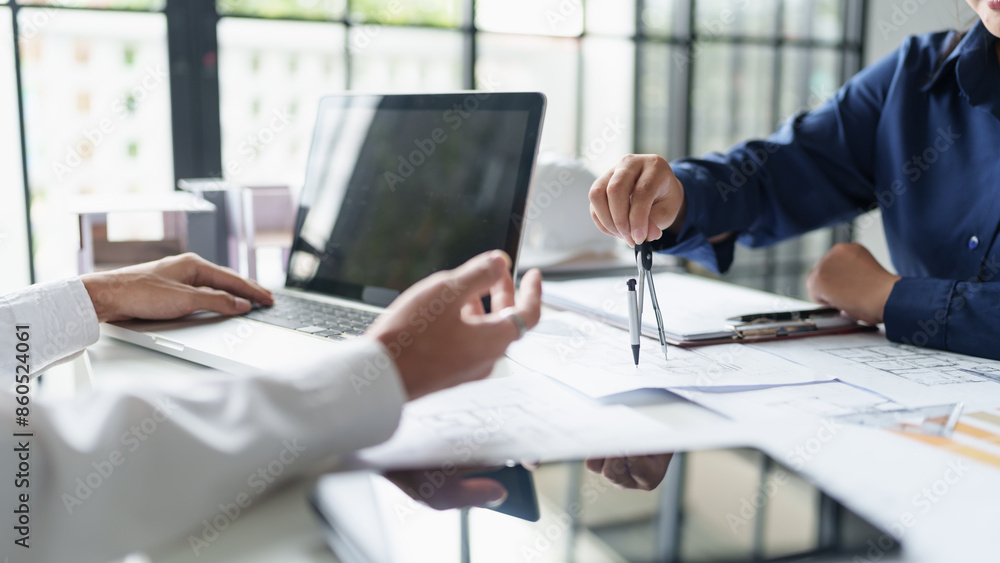 Architecture drawing on architectural project business architecture building construction Colleagues designer Planning Design on blueprint and compasses Architecture drawing on architectural project business architecture building construction Colleagues designer Planning Design on blueprint and compasses