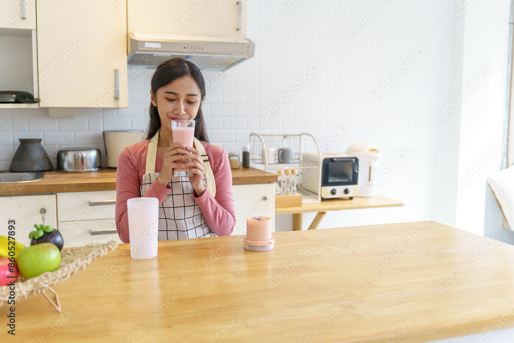 Asian woman making healthy drinking fresh homemade in home kitchen counter Asian woman making healthy drinking fresh homemade in home kitchen counter
