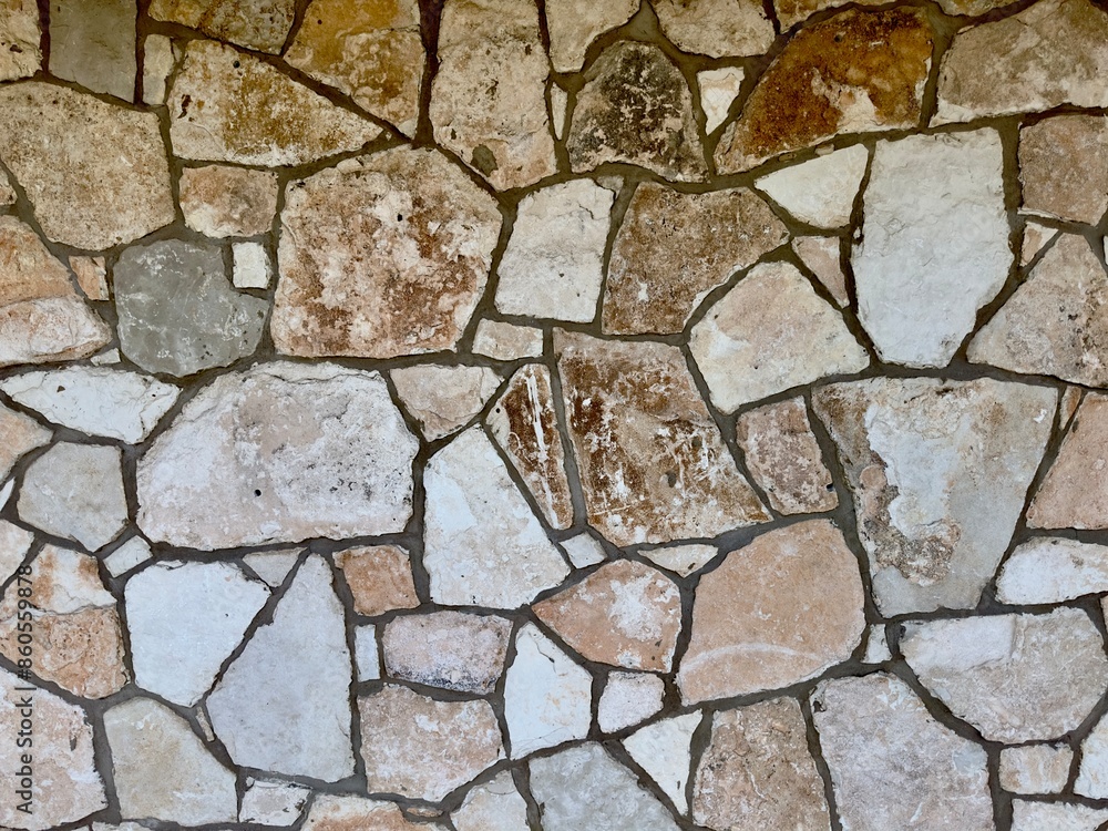 A decorative exterior rock wall features intricate patterns and natural textures, blending rugged stones into a visually appealing and durable structure that enhances the aesthetic of outdoor spaces. A decorative exterior rock wall features intricate patterns and natural textures, blending rugged stones into a visually appealing and durable structure that enhances the aesthetic of outdoor spaces.