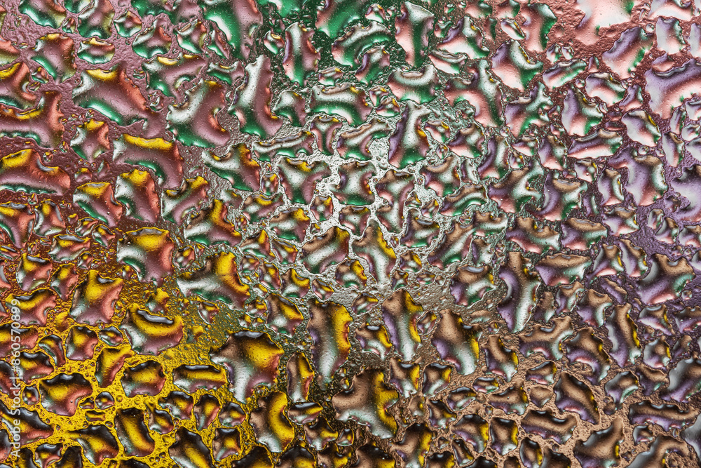 Macro shot of colorful water drops on glass. Abstract background. Macro shot of colorful water drops on glass. Abstract background.