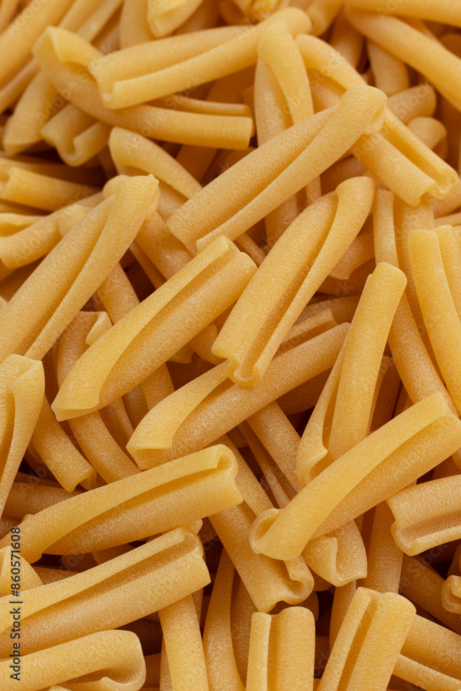 High-quality Italian pasta casarecce. Extruded through traditional bronze dies. Top view. High-quality Italian pasta casarecce. Extruded through traditional bronze dies. Top view.