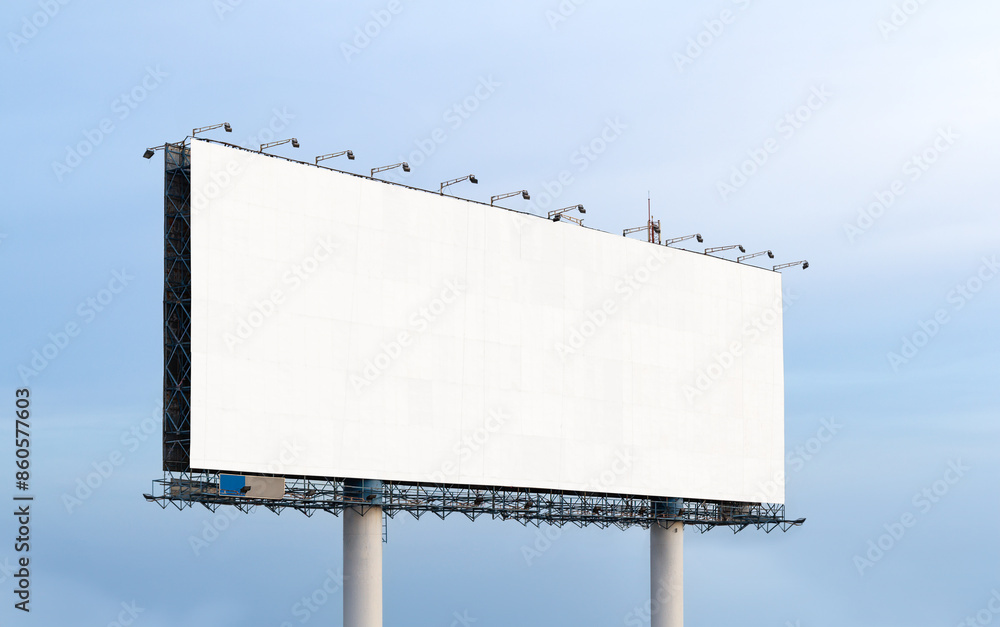 Obraz premium extra large Outdoor billboard with white background mock up. on clouds and blue sky background. Copy space for advertisement.