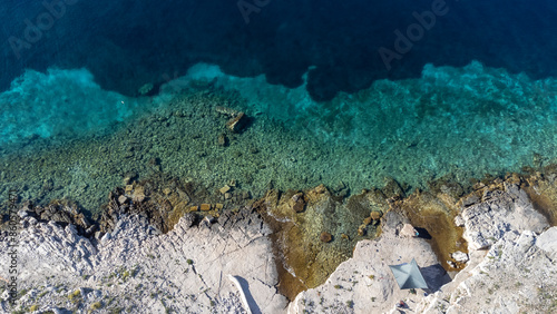 Obraz na płótnie drone view of sun sail on the Mediterranean coast of the island Zirje in Croatia w salonie