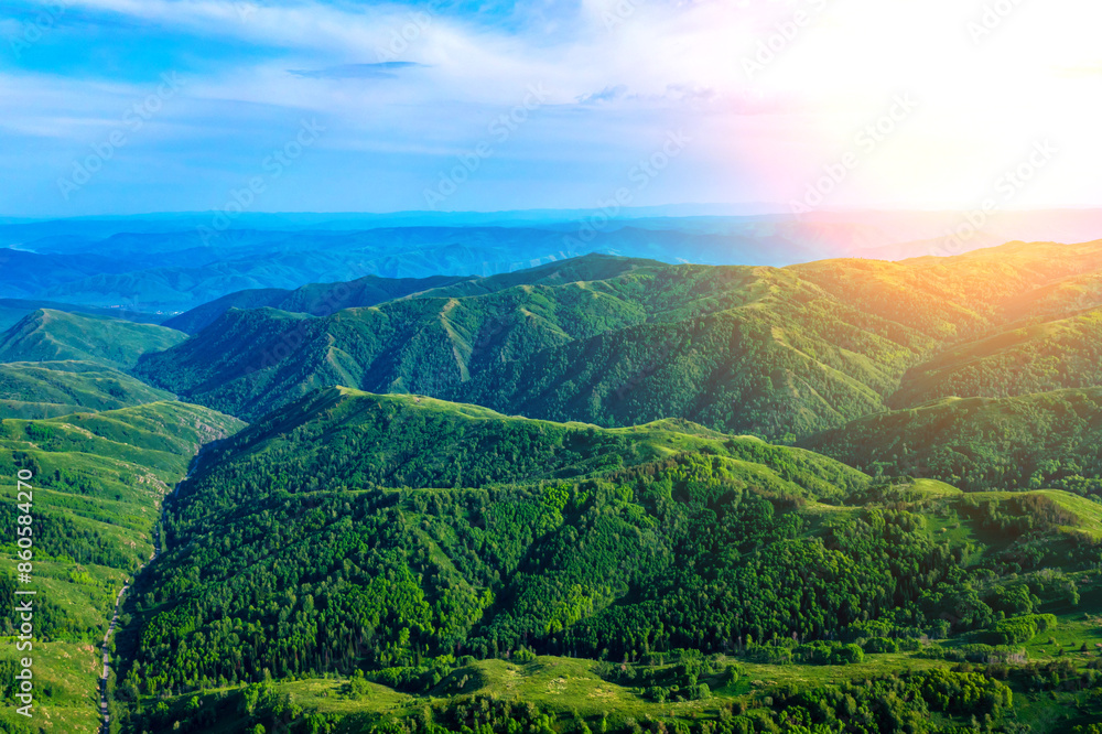 Obraz premium Drone view on forested mountain peaks, beautiful valleys, wildlife of Kazakhastan
