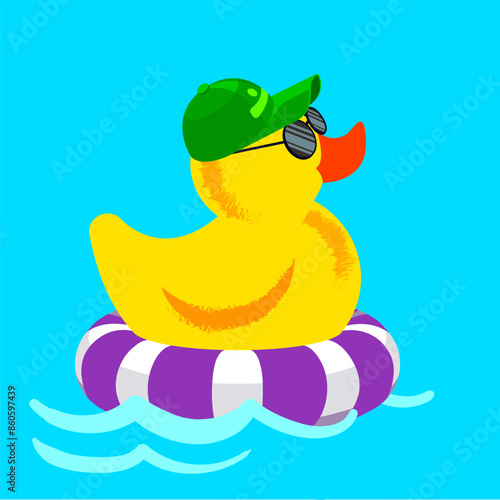 The cute yellow rubber ducky is swimming on a inflatable ring.