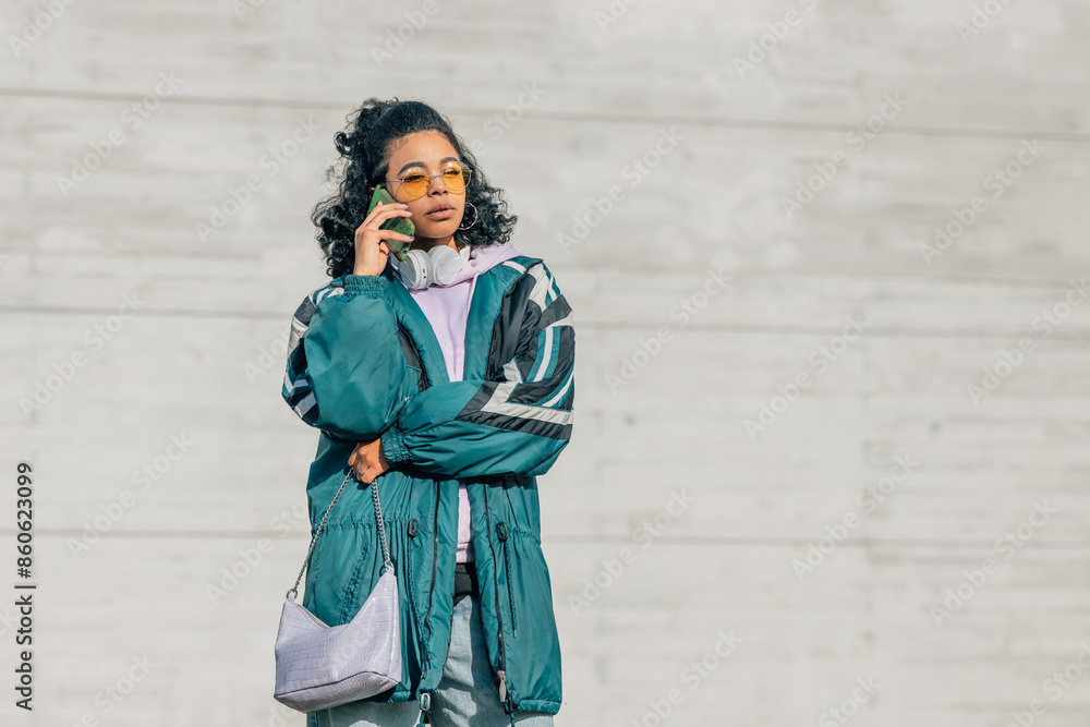 urban girl on the street talking on mobile phone urban girl on the street talking on mobile phone