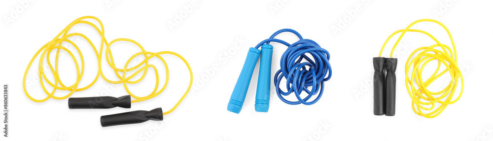 Different skipping ropes on white background, set. Sport equipment Different skipping ropes on white background, set. Sport equipment