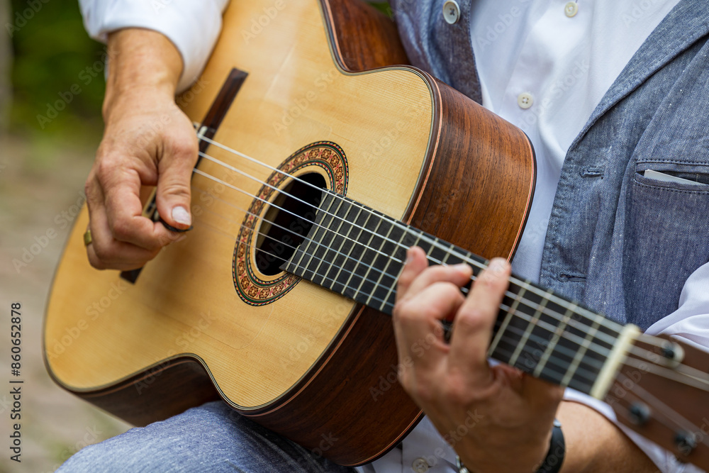 Fototapeta premium close up of a man playing guitar
