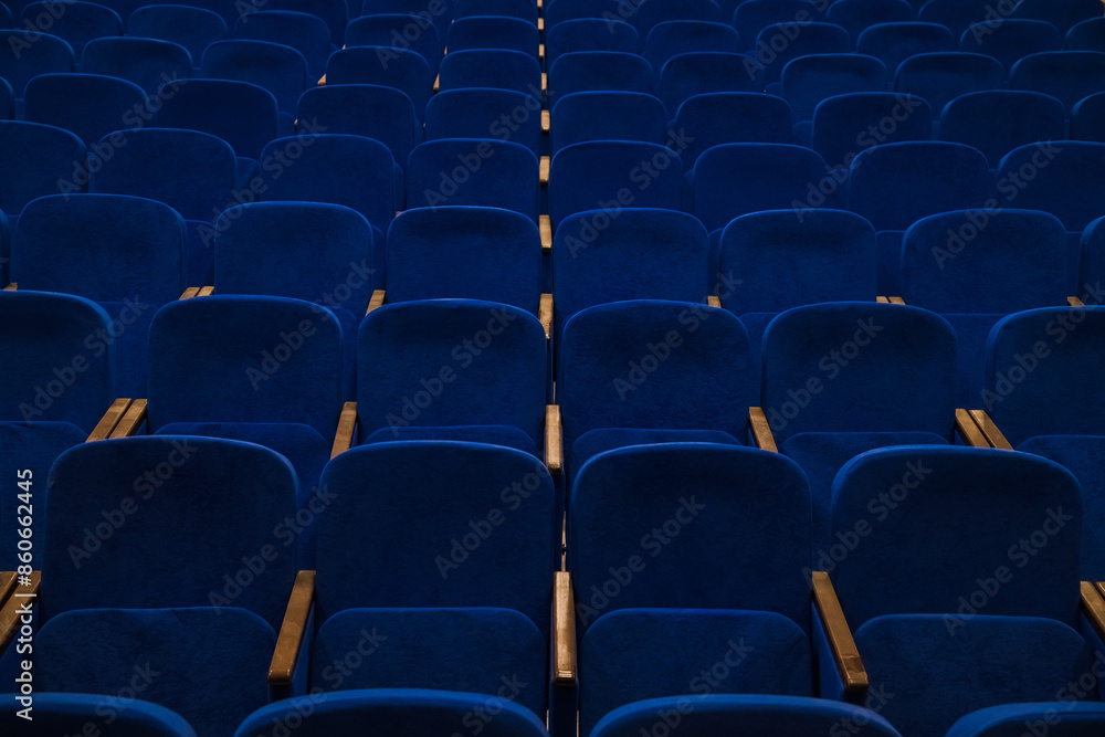 Blue empty seats in the audience prepared for the participants of the conference or presentation Blue empty seats in the audience prepared for the participants of the conference or presentation