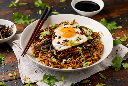 Photography Scallion Oil Noodles with fried egg on top and chilli oil