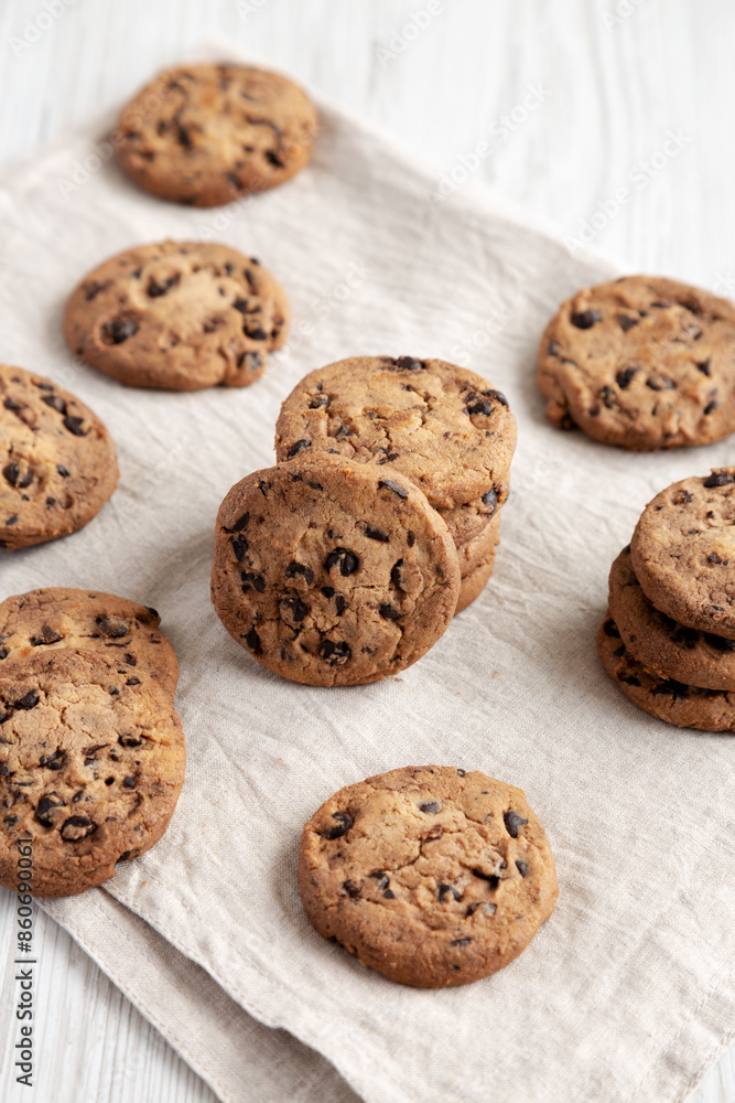 Homemade Gooey Chocolate Chip Cookies on a white wooden background, side view. Homemade Gooey Chocolate Chip Cookies on a white wooden background, side view.